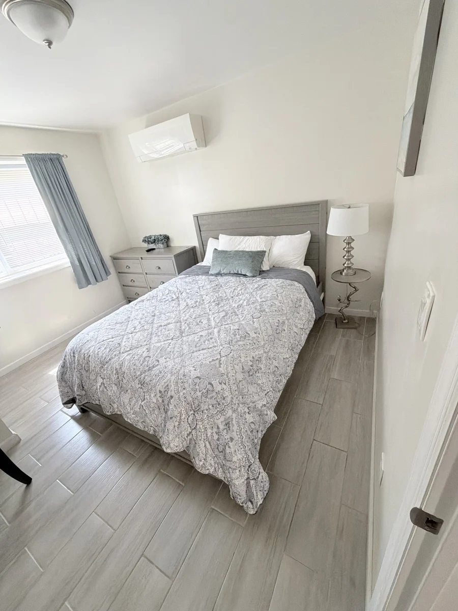 Clean and organized Airbnb bedroom by Deluxe Cleaning Services